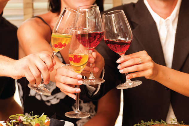 Group of people toasting with wine glasses