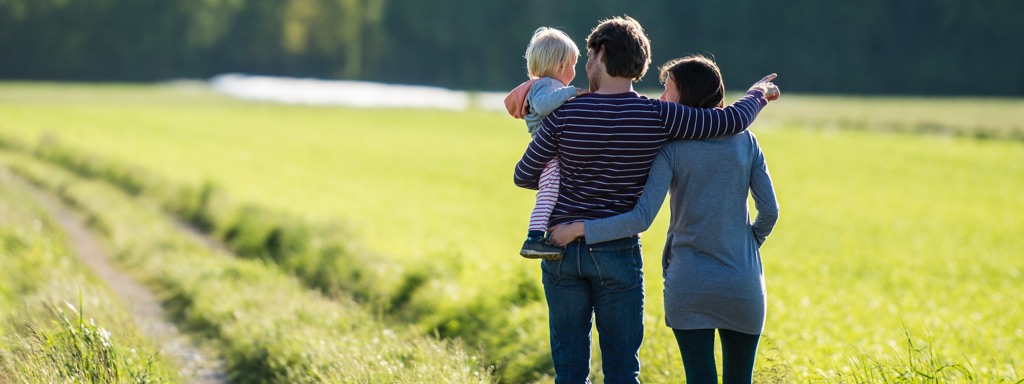 Young family reviewing property